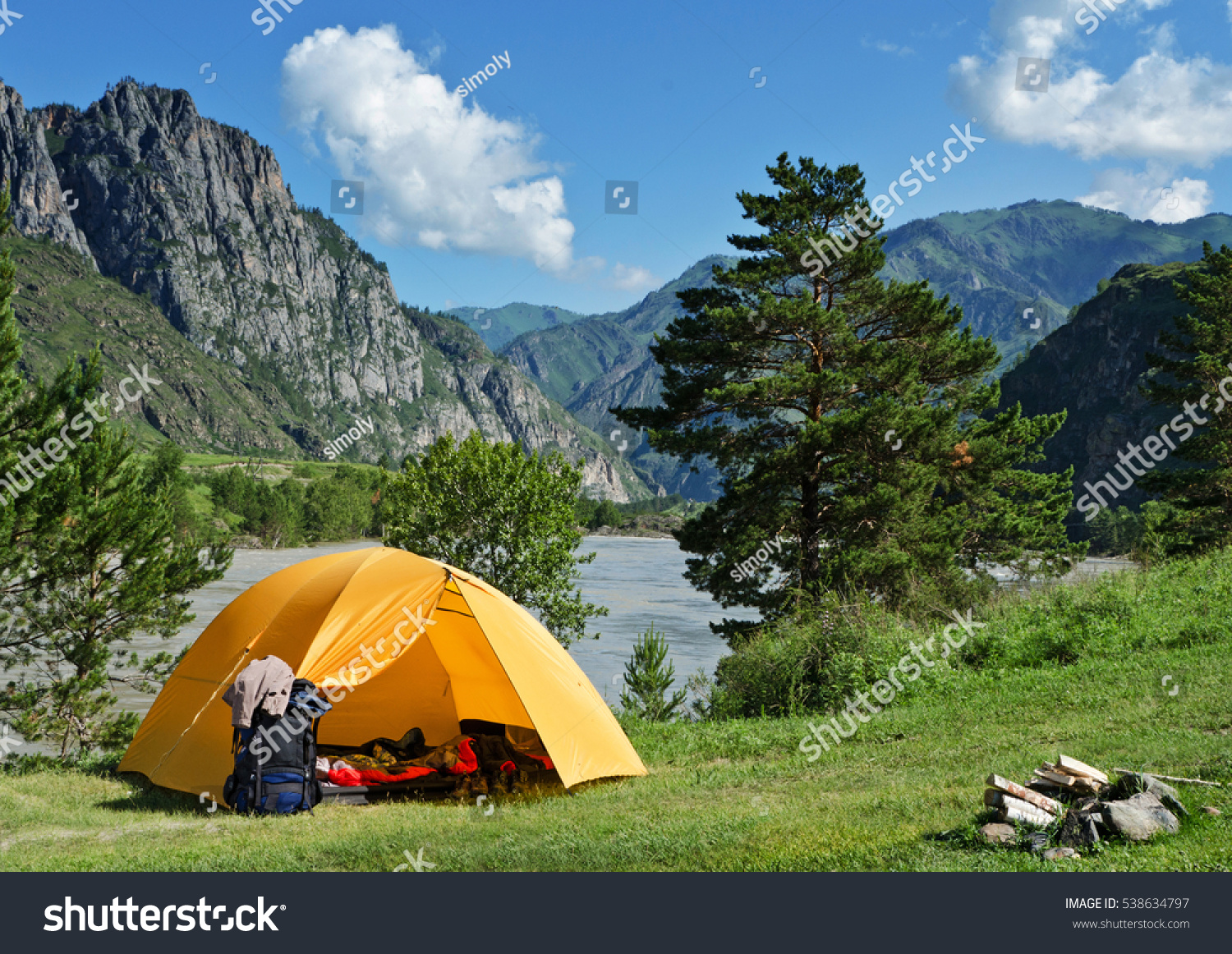 The Camping Tent near mountain river in the summer #538634797