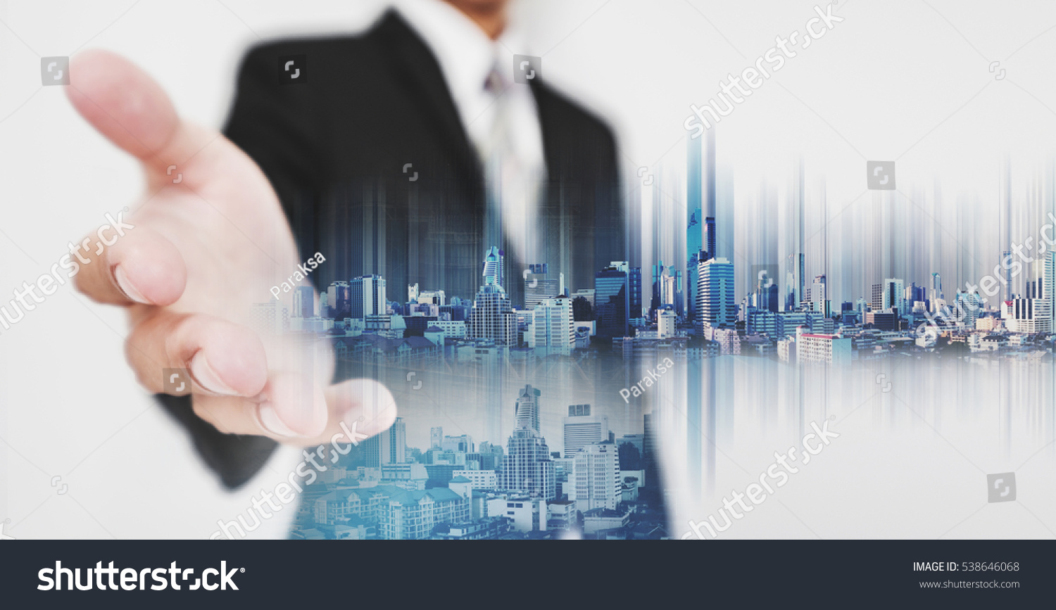Businessman stretch out hand, with double exposure city and real estate site construction, and hologram futuristic city #538646068