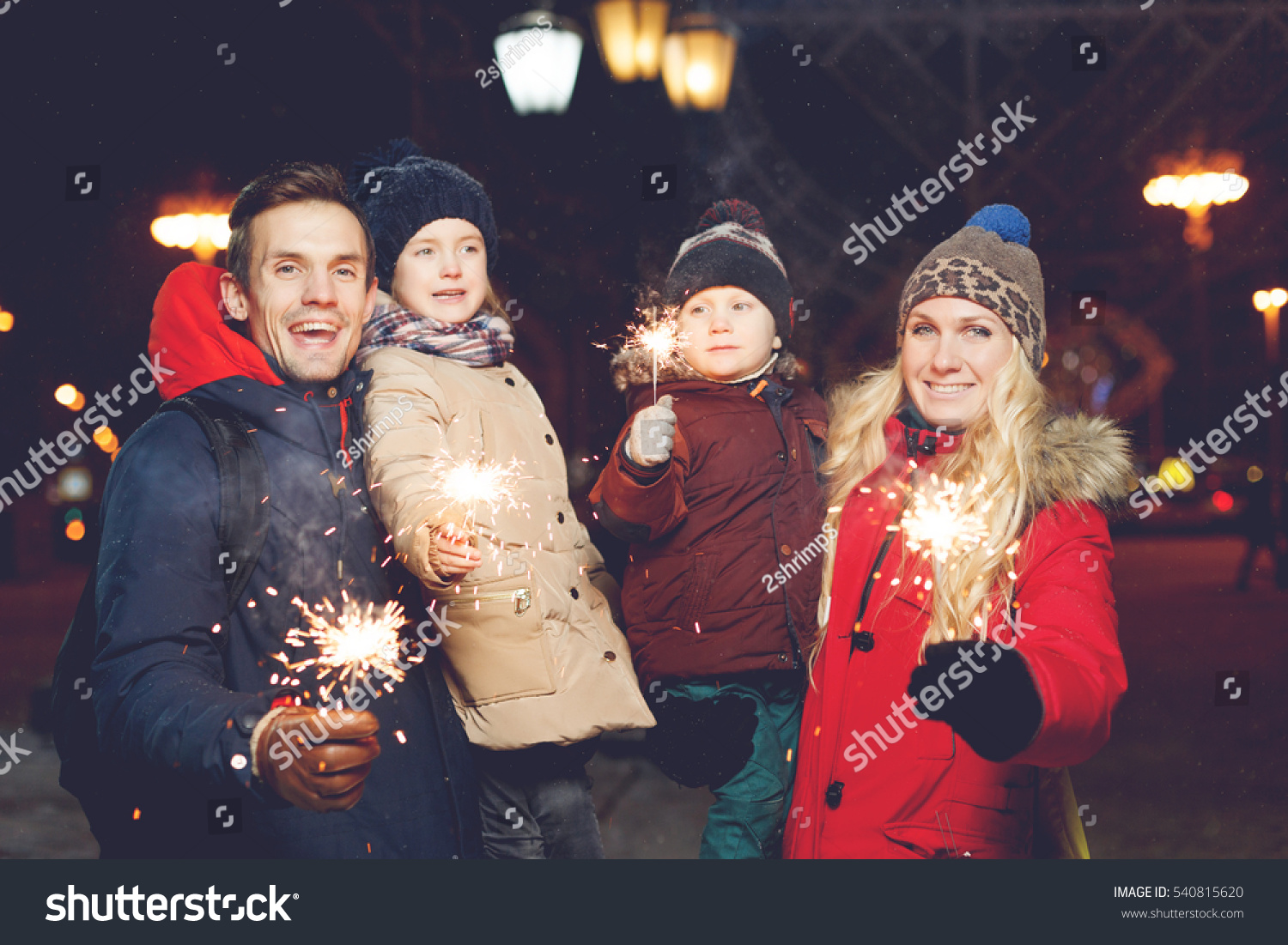 Beautiful family with burning sparklers #540815620