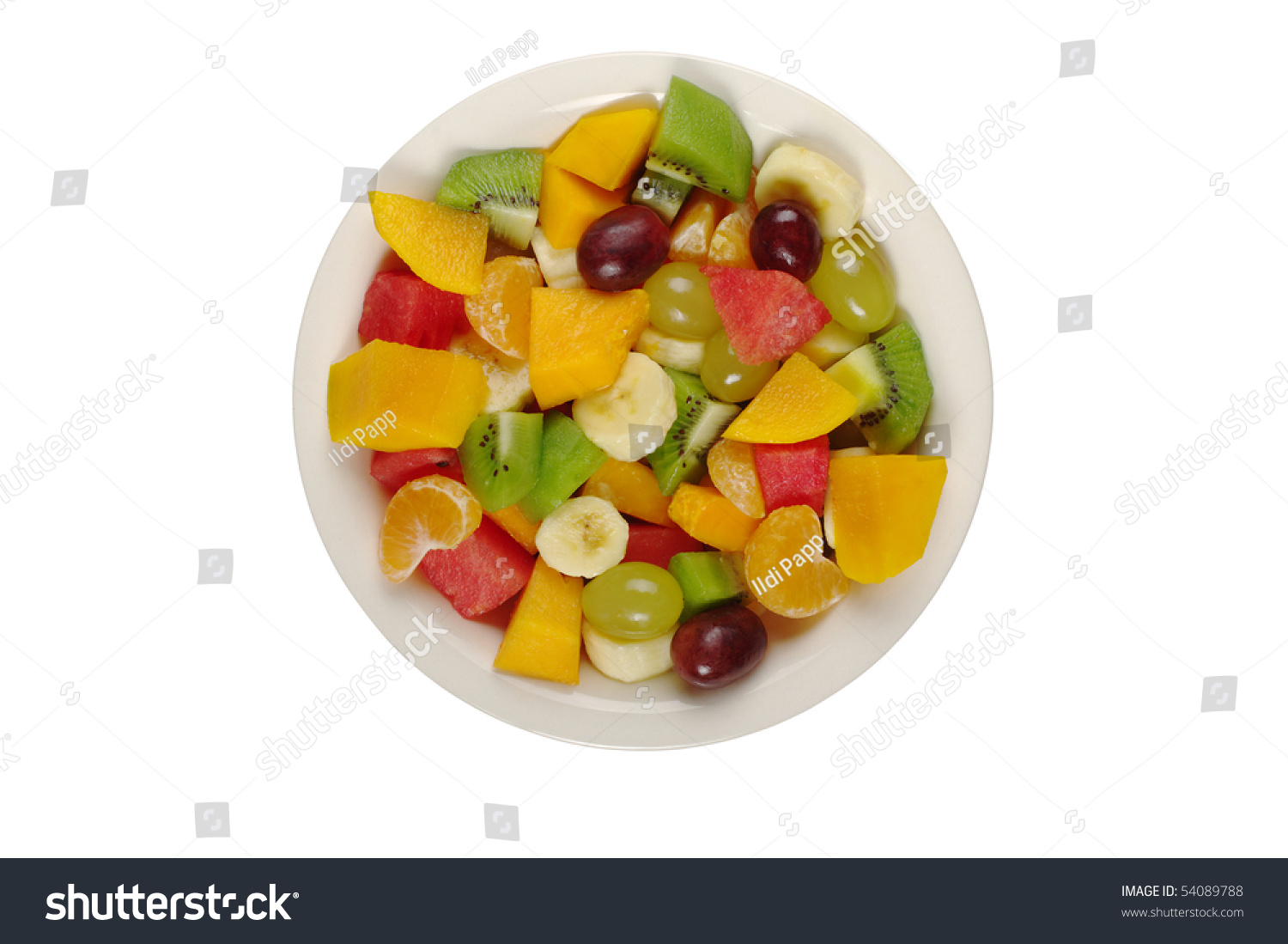 Tropical fruit salad on white plate on white background photographed from above (Isolated) #54089788