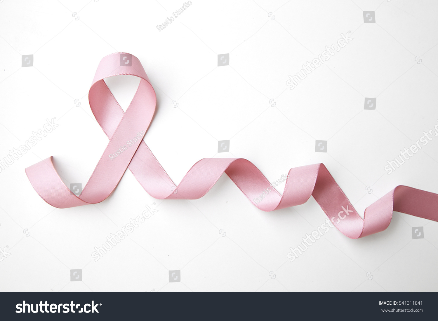 Pink awareness ribbon with trail on white background #541311841