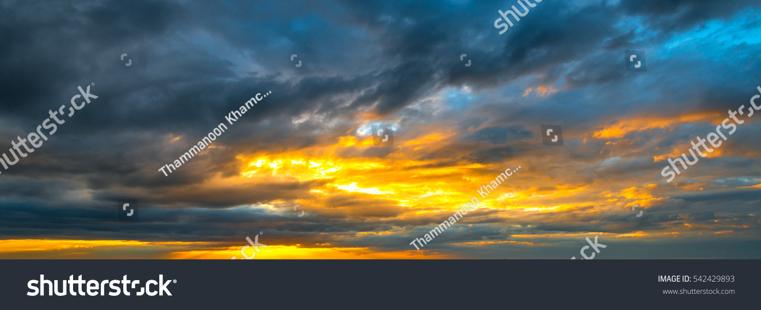 panorama Sunlight with dramatic sky on dark background.Vivid sky on dark cloud. #542429893