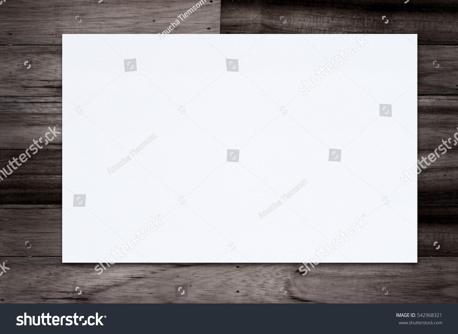 Blank paper texture on wood background. #542968321