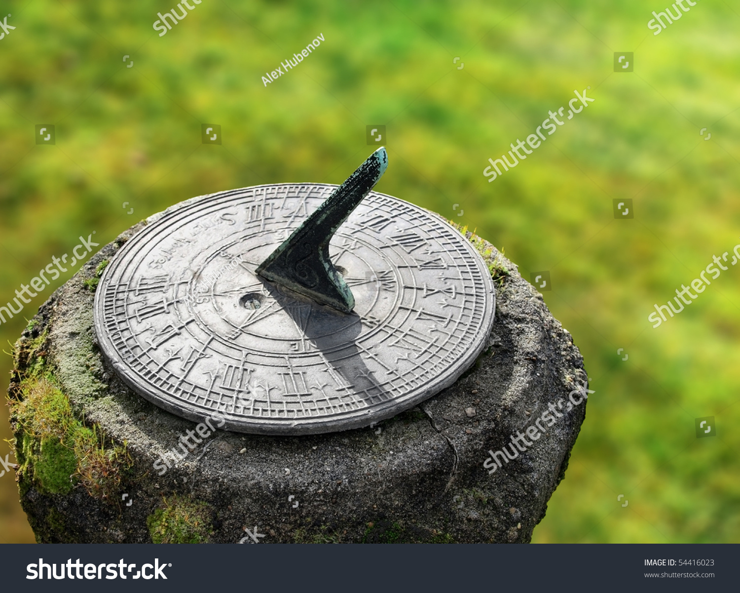 old sun clock dial in a garden #54416023