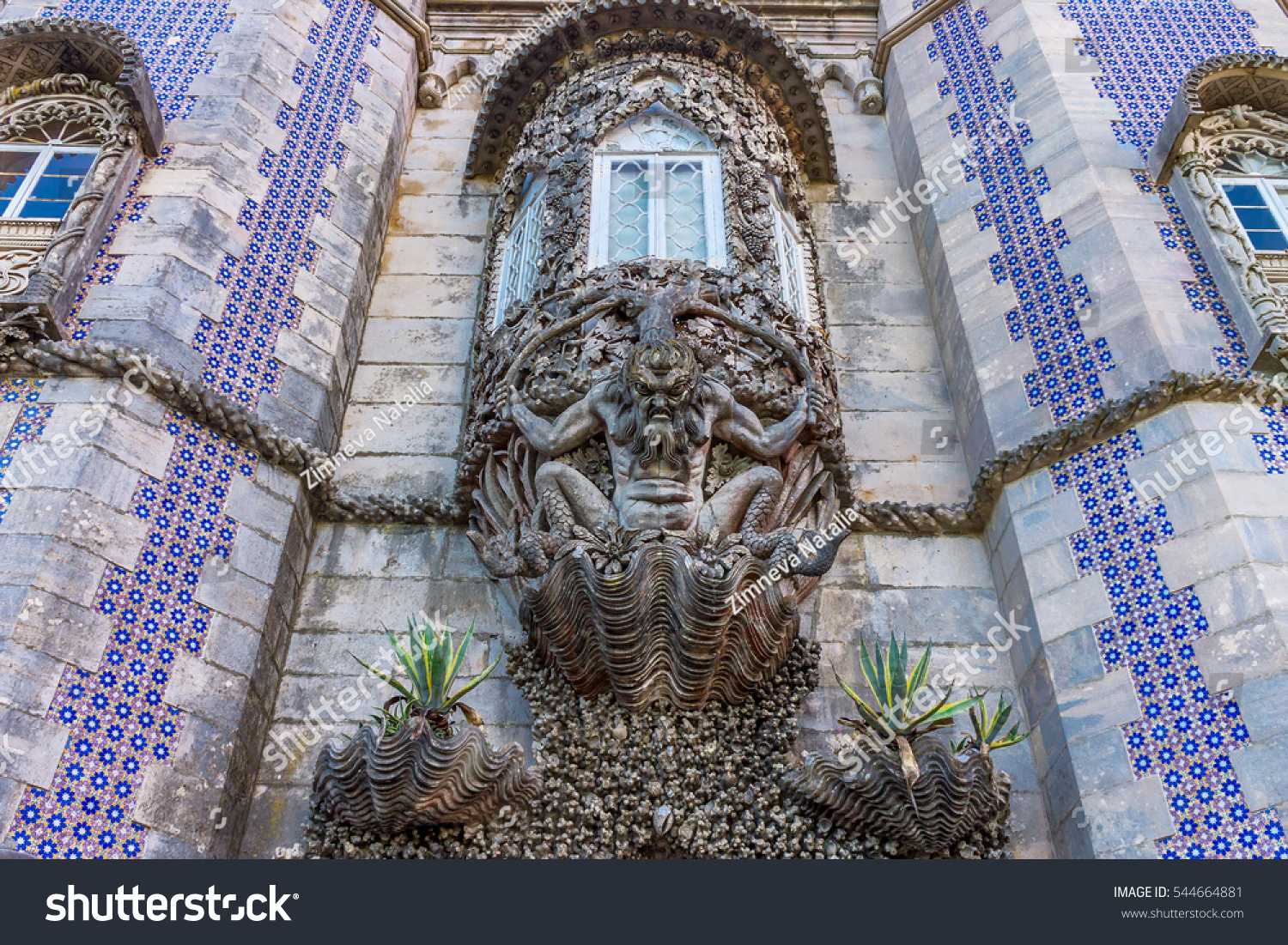 Carved stone figure of a sea monster in a wall at the Palacio da Pena, Sintra, Portugal. Pena National Palace the oldest palace inspired by European Romanticism. UNESCO World Heritage Site #544664881
