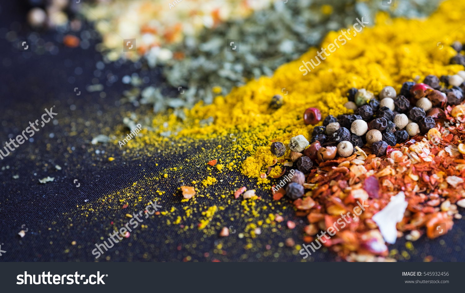 Spices and herbs on a black background #545932456