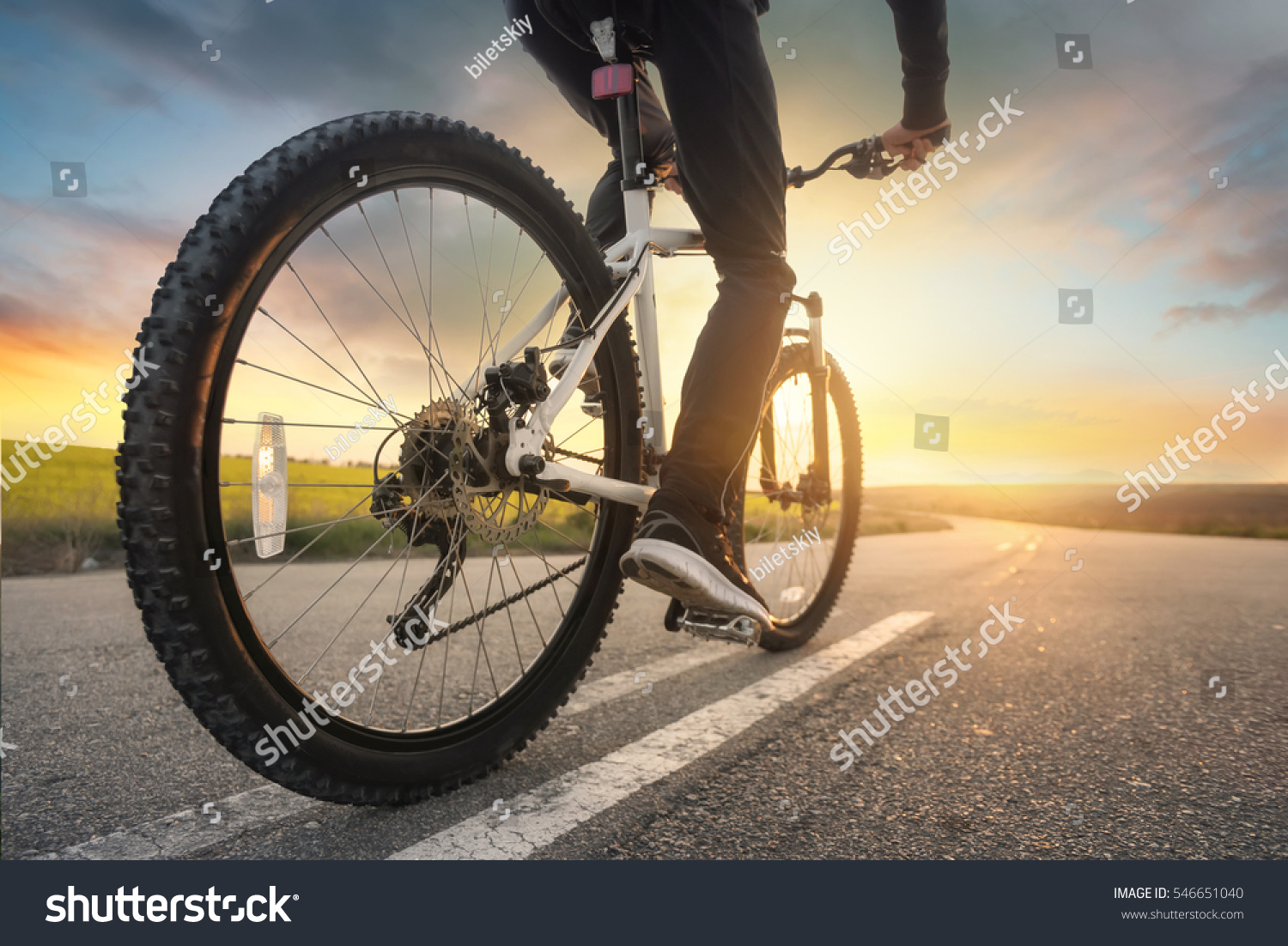Ride on bike on the road. Sport and active life concept in the summer time #546651040