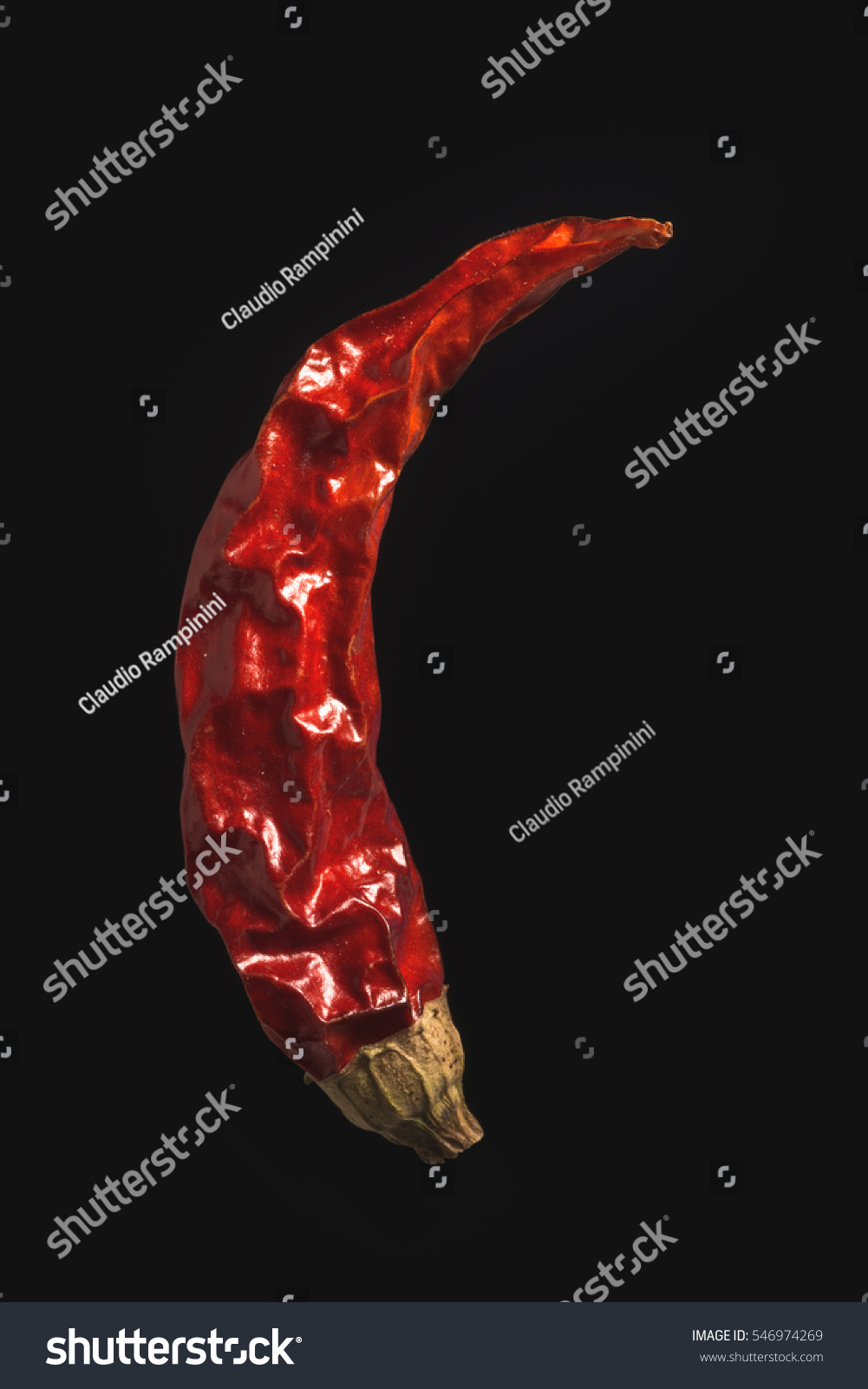 Dry chili pepper on isolated black background close-up #546974269