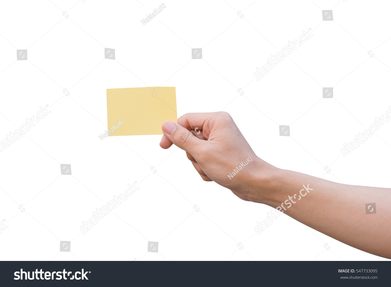 Hand holding yellow paper isolated on white #547733095
