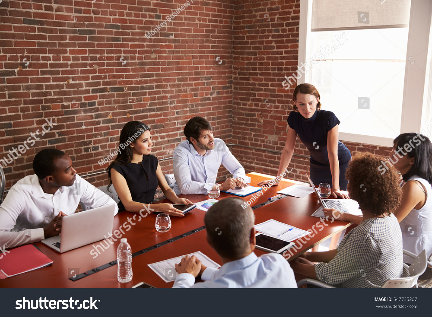 Young Businesswoman Addressing Boardroom Meeting #547735207