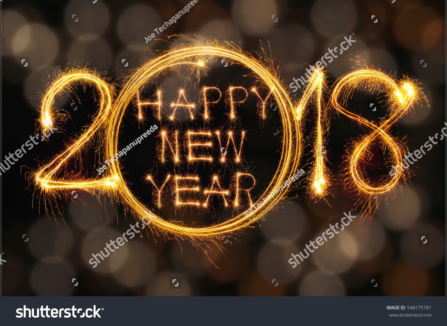 Happy new year 2018 text written with Sparkle fireworks isolated on black background #548175781