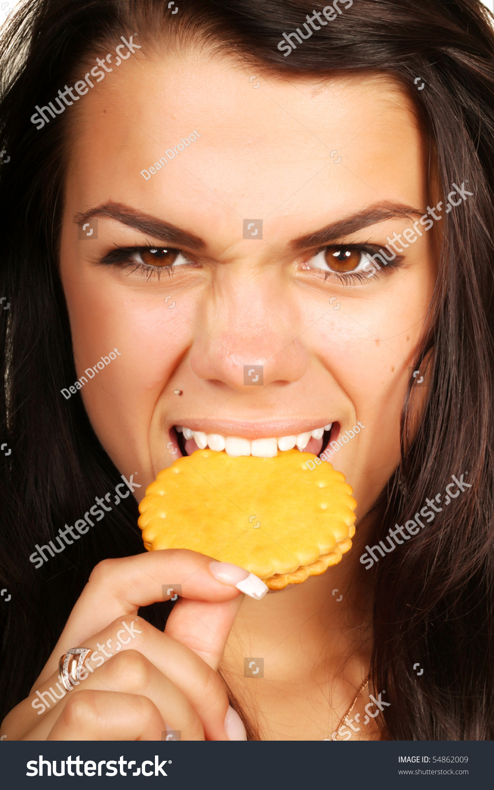 Woman eating cookie with anger #54862009