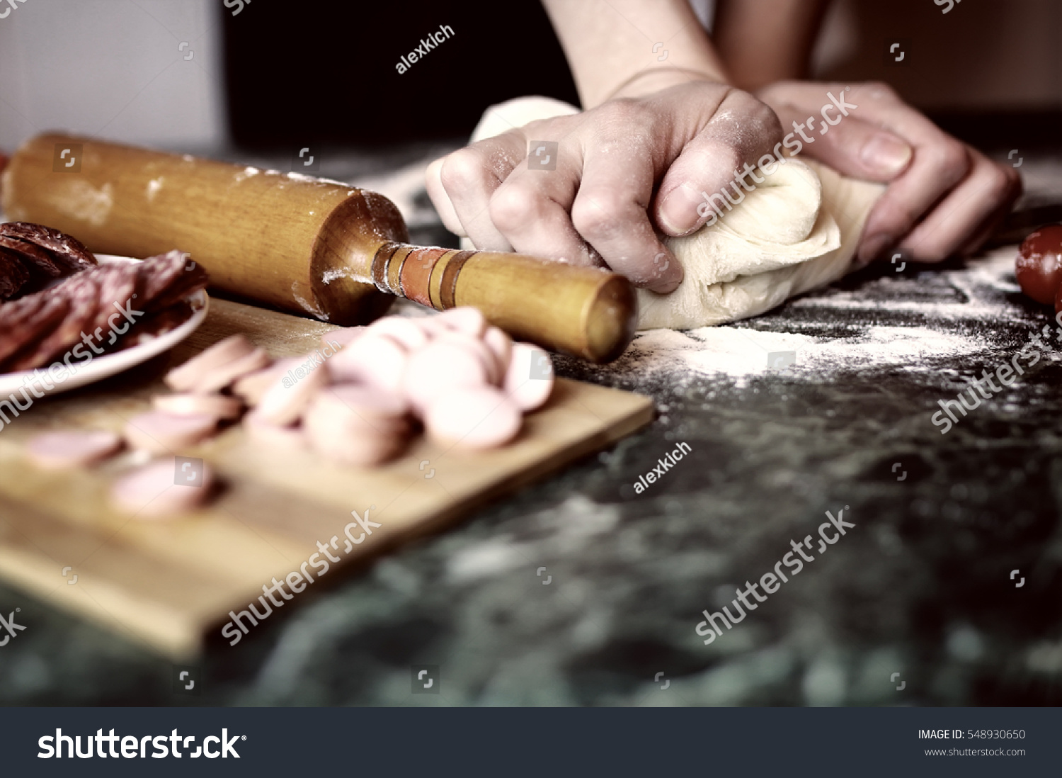 pizza prepare dough hand topping #548930650