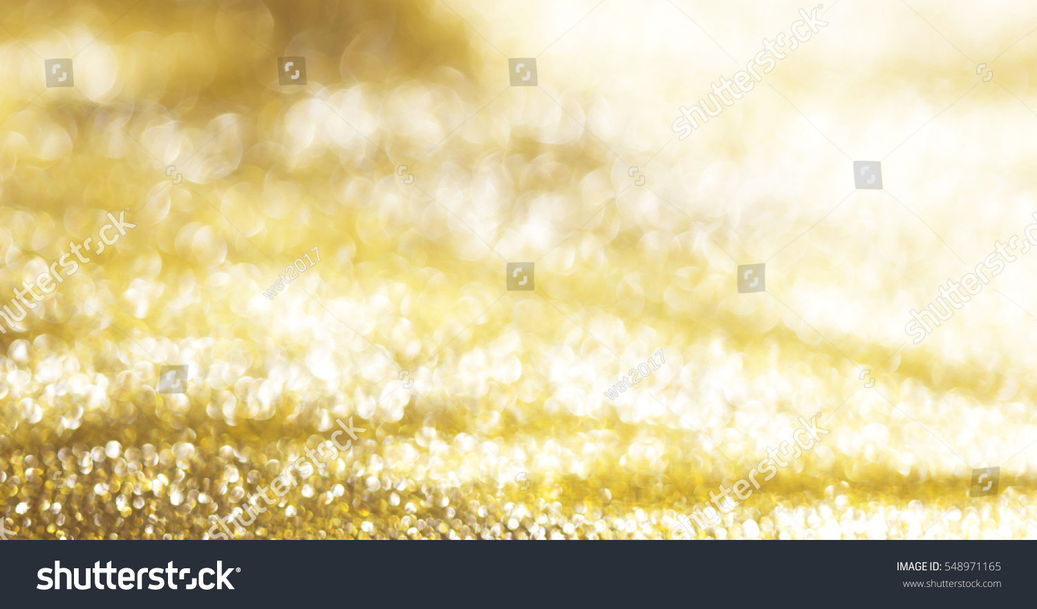 Gold abstract bokeh background paper glossy shine. #548971165