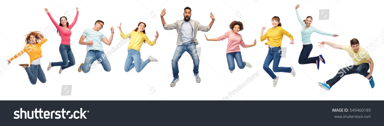 happiness, freedom, motion, diversity and people concept - international group of happy smiling men and women jumping over white background #549460189