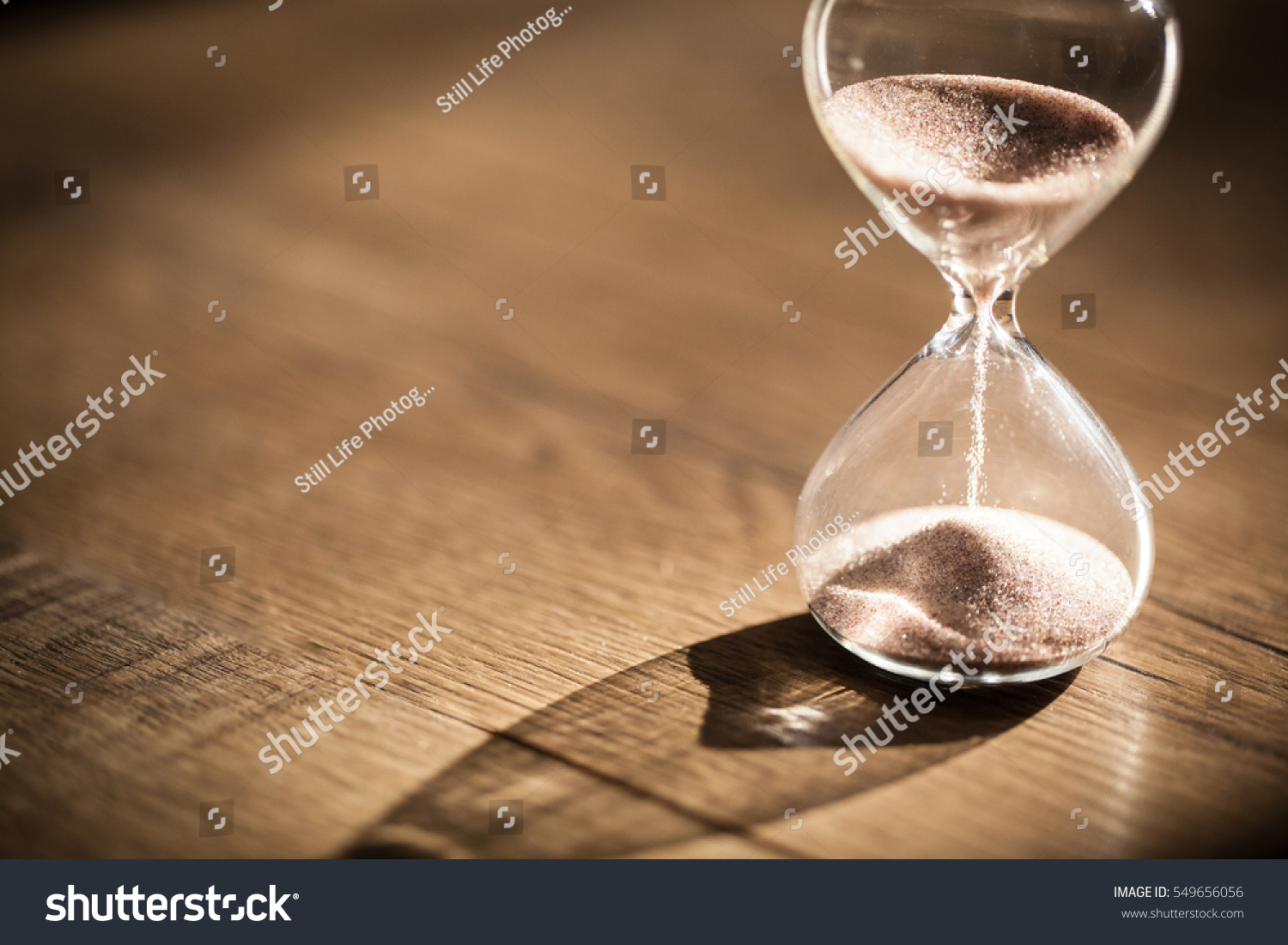 Hourglass as time passing concept for business deadline, urgency and running out of time. #549656056