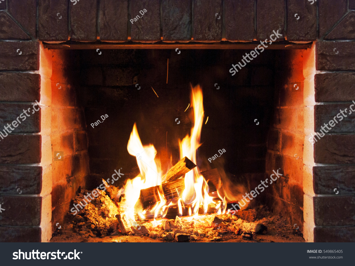 Burning fireplace. Fireplace as a piece of furniture #549865405