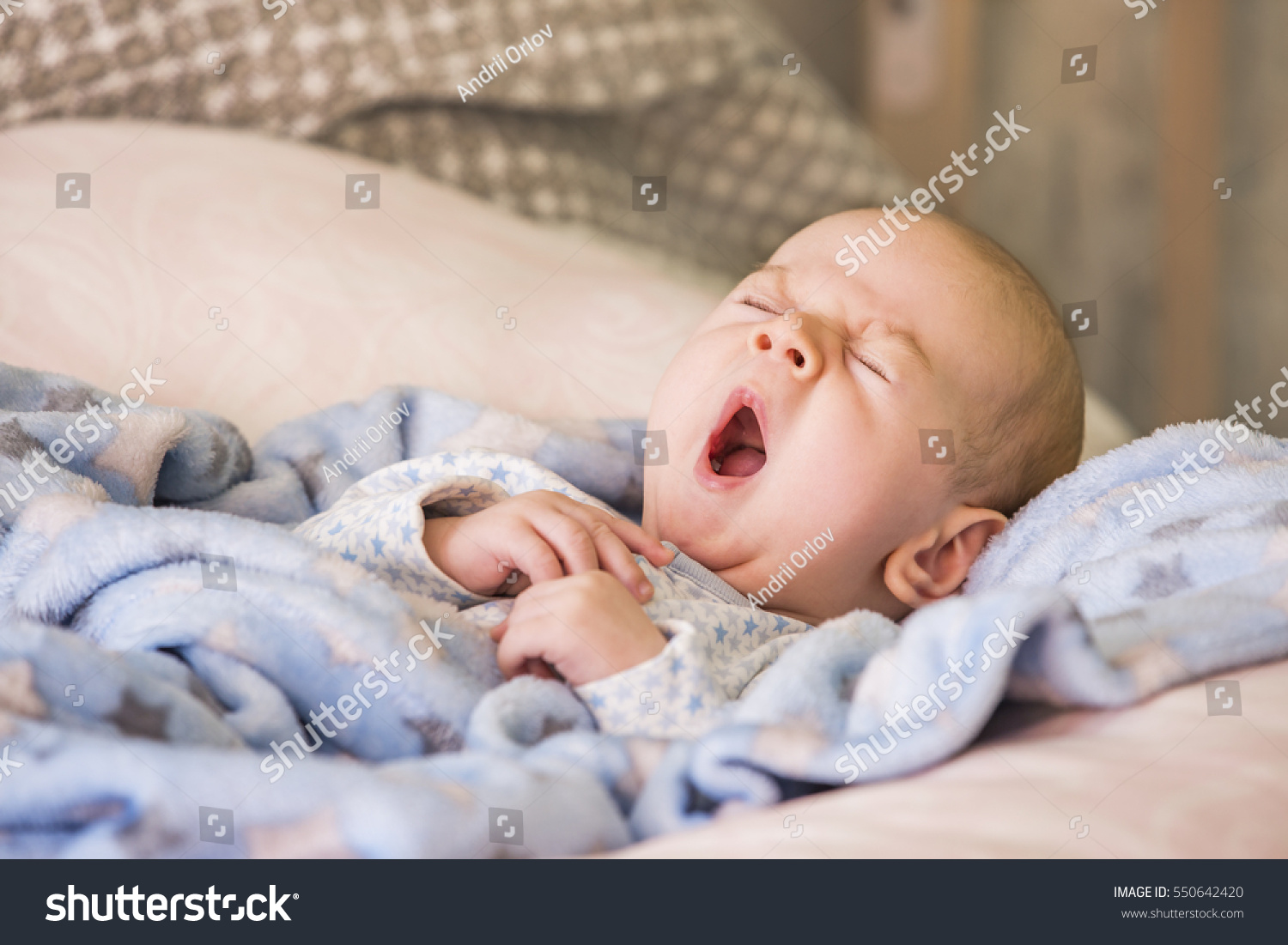 Cute baby yawning before sleep #550642420