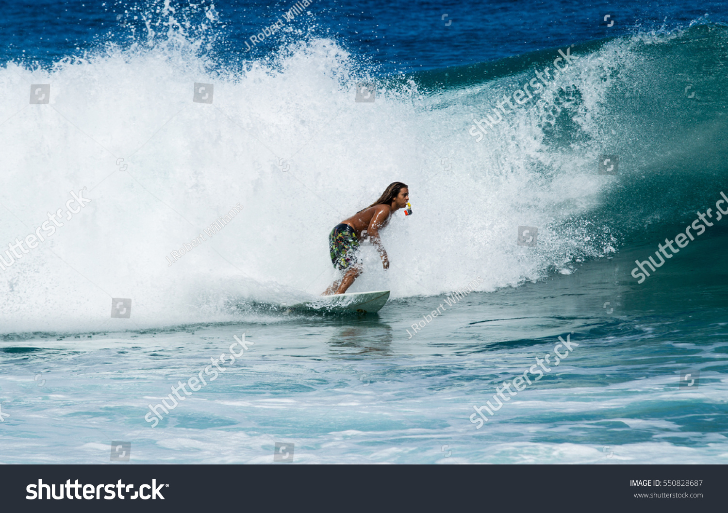 September 6, 2016 - Banzia Pipeline Oahu Hawaii. A surfer rides waves on Oahu's famous surf. #550828687