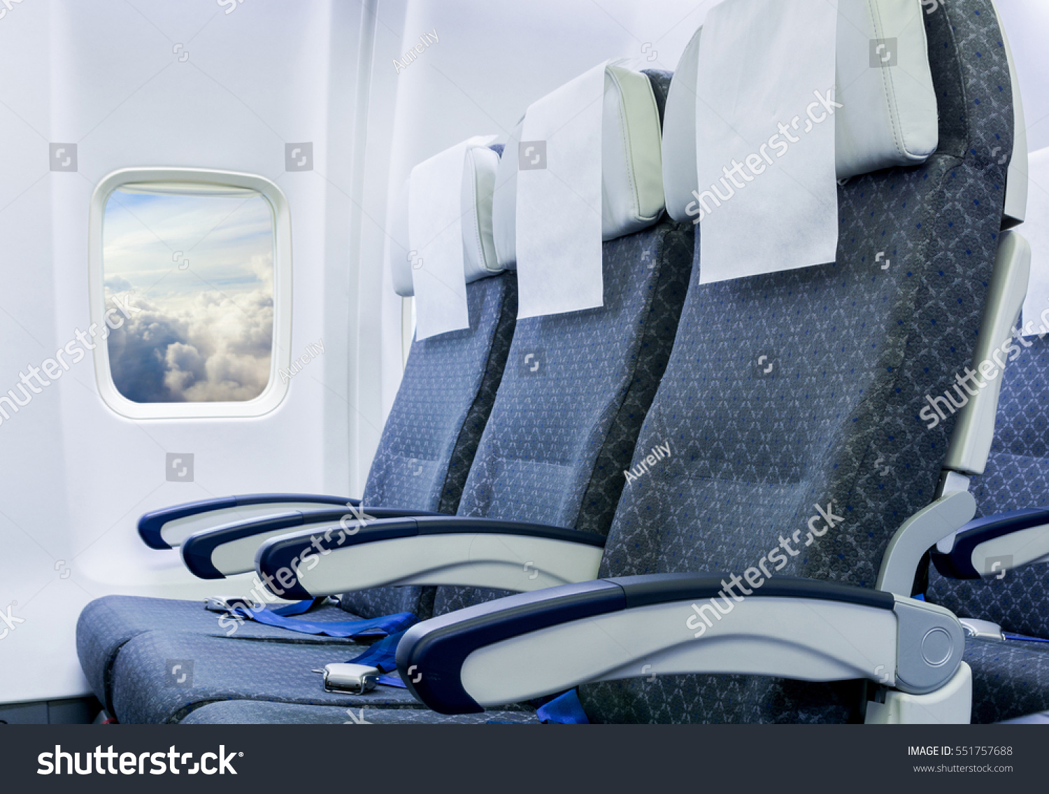 Airplane seats in the cabin economy class #551757688