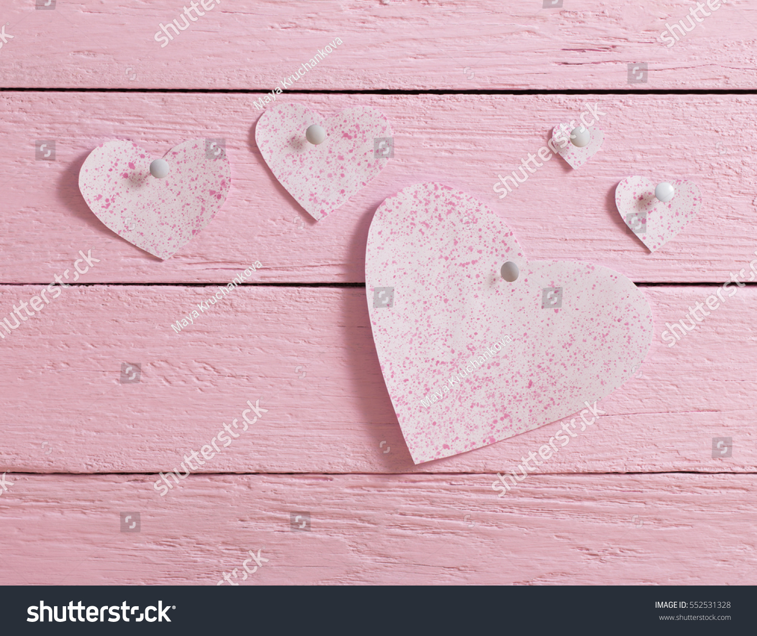 pink heart made of paper on wooden background #552531328