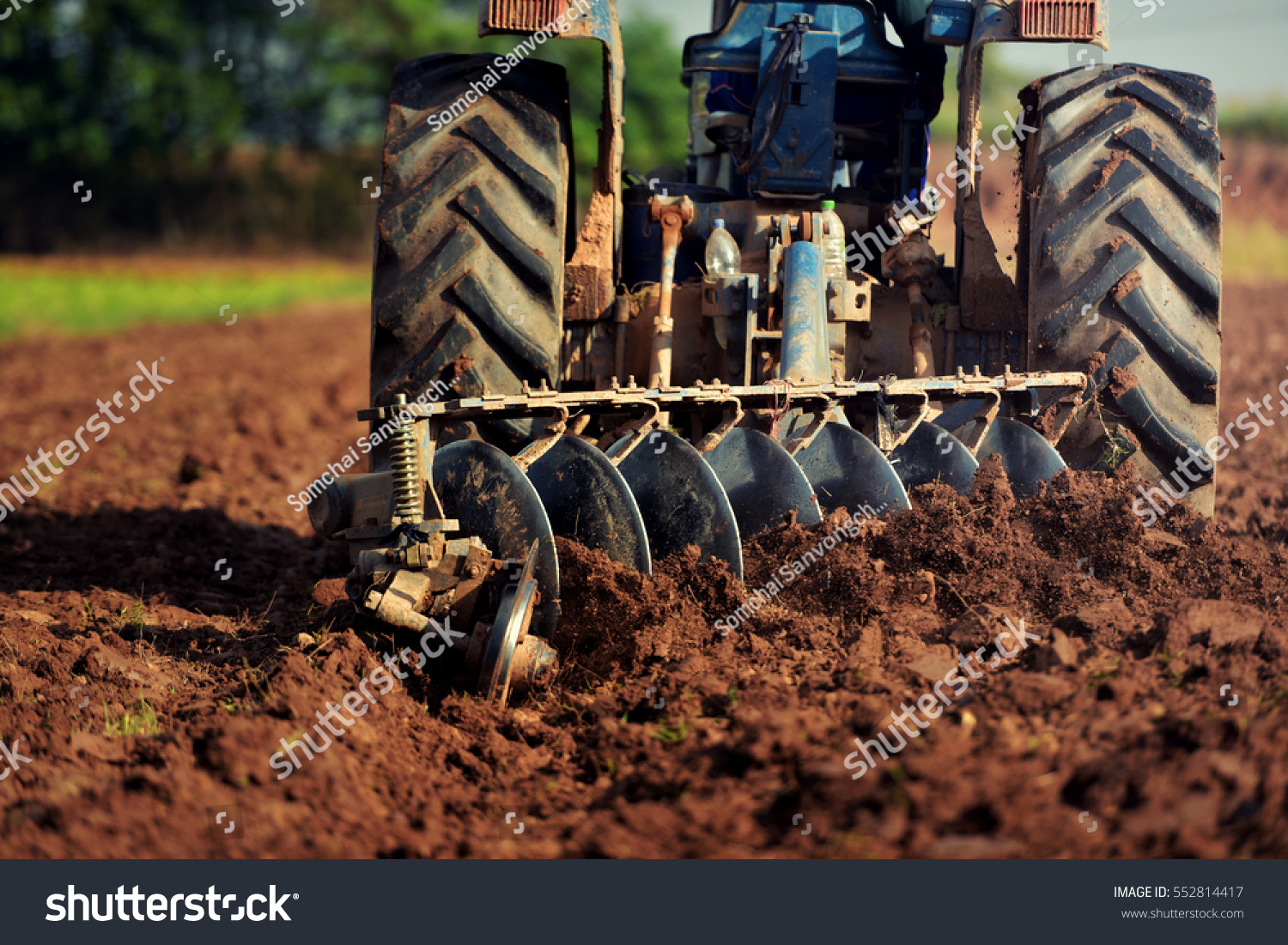 Agricultural workers with tractors #552814417