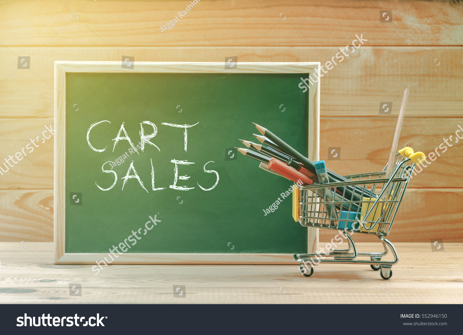Cart sales text display on chalkboard with shopping cart #552946150