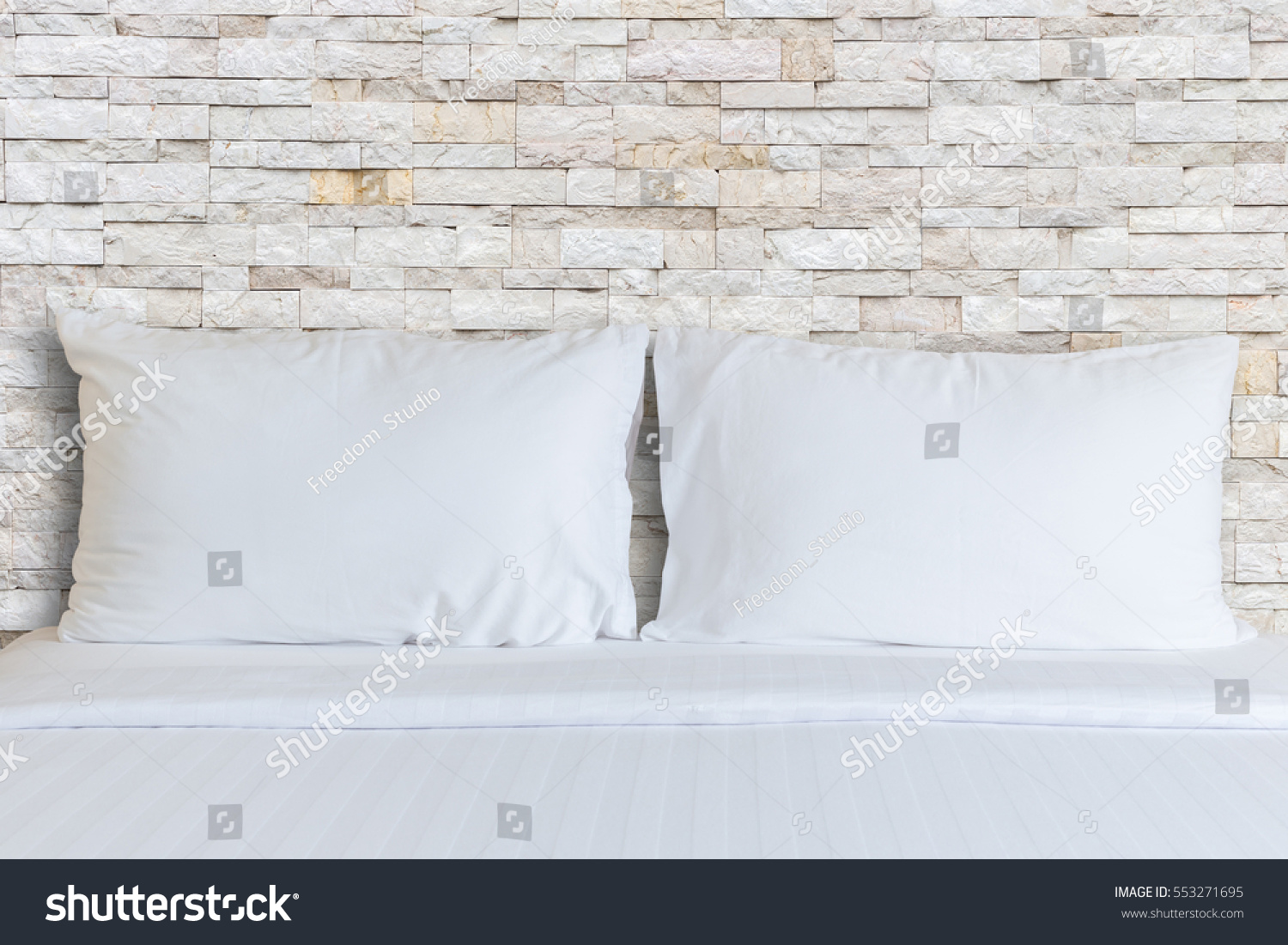 Close up white bedding sheets and pillow in hotel room. #553271695