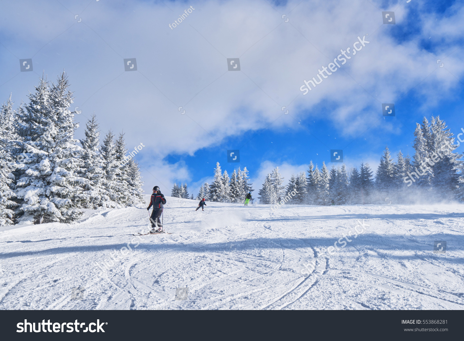 mountain ski slope on a sunny day. Winter mountain landscape #553868281