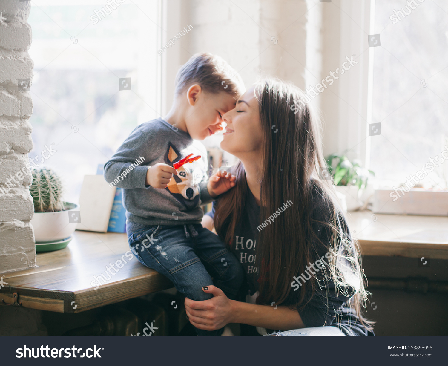 mother kissing her little son #553898098