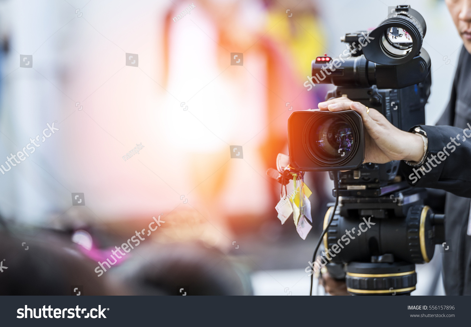 Video camera operator working with his equipment #556157896