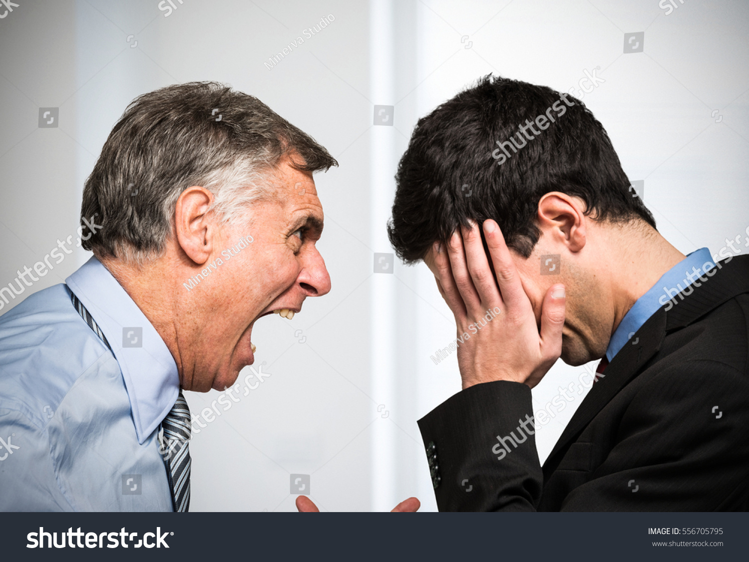 Angry boss shouting to an employee #556705795