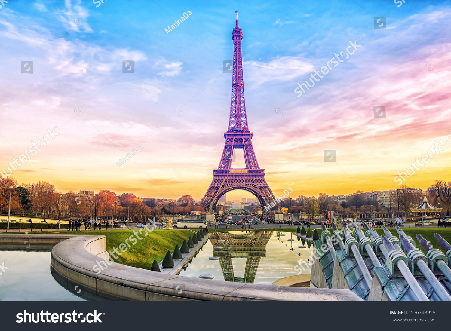 Eiffel Tower at sunset in Paris, France. Romantic travel background. #556743958