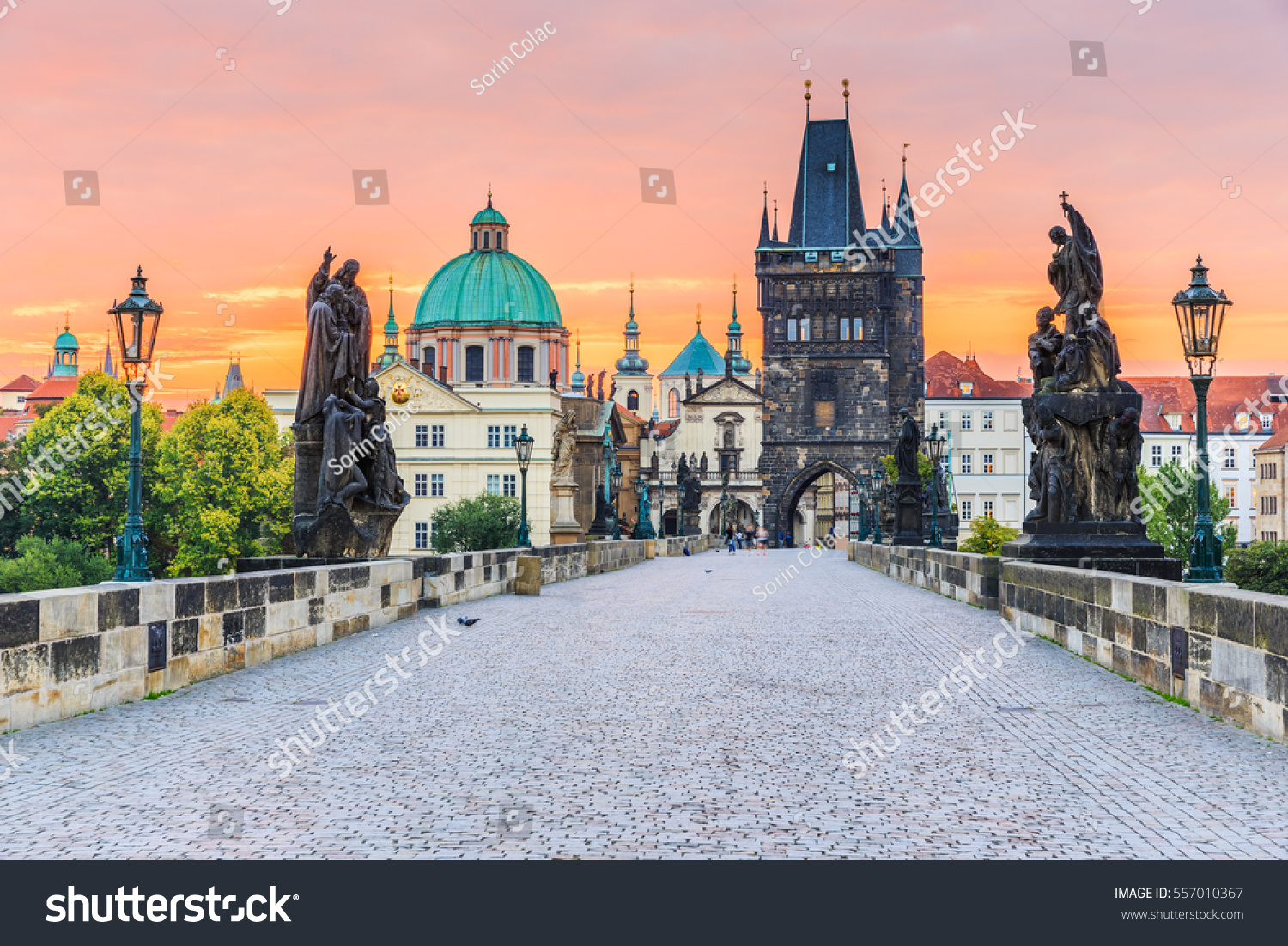 Prague, Czech Republic. Charles Bridge (Karluv Most) and Old Town Tower at sunrise. #557010367
