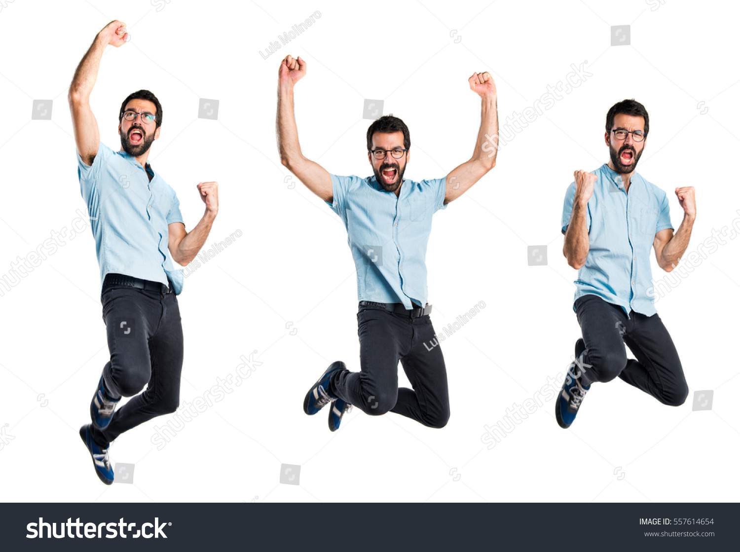 Handsome man with blue glasses jumping #557614654