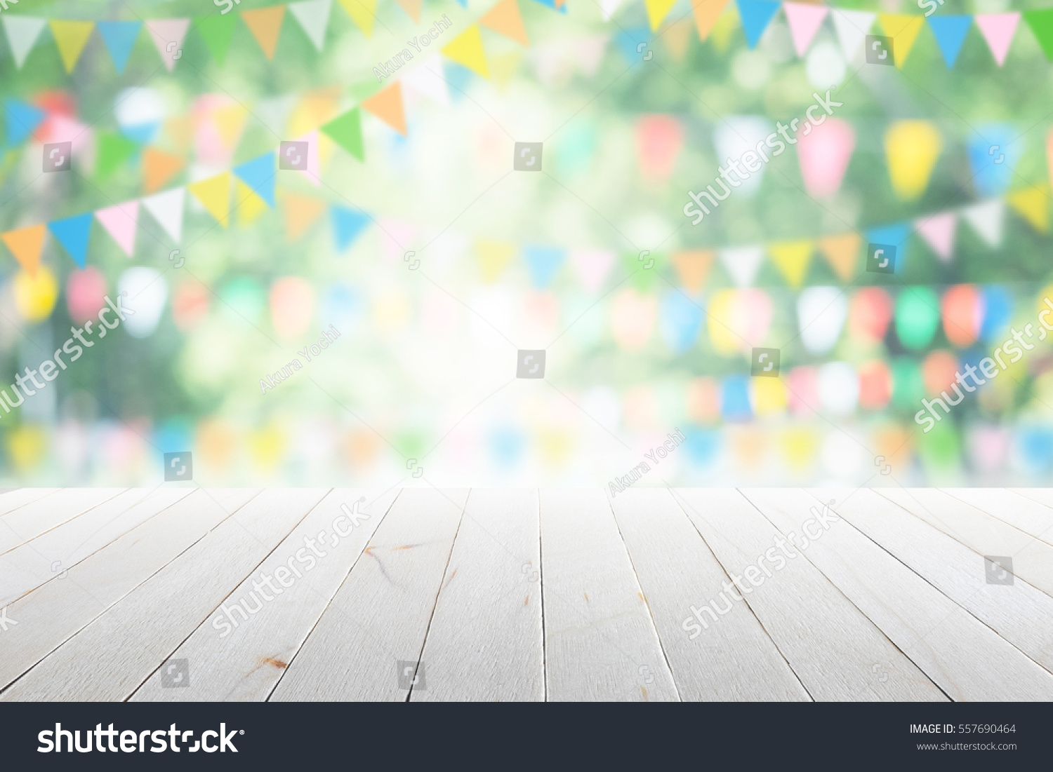 Empty wooden table with party in garden background blurred. #557690464