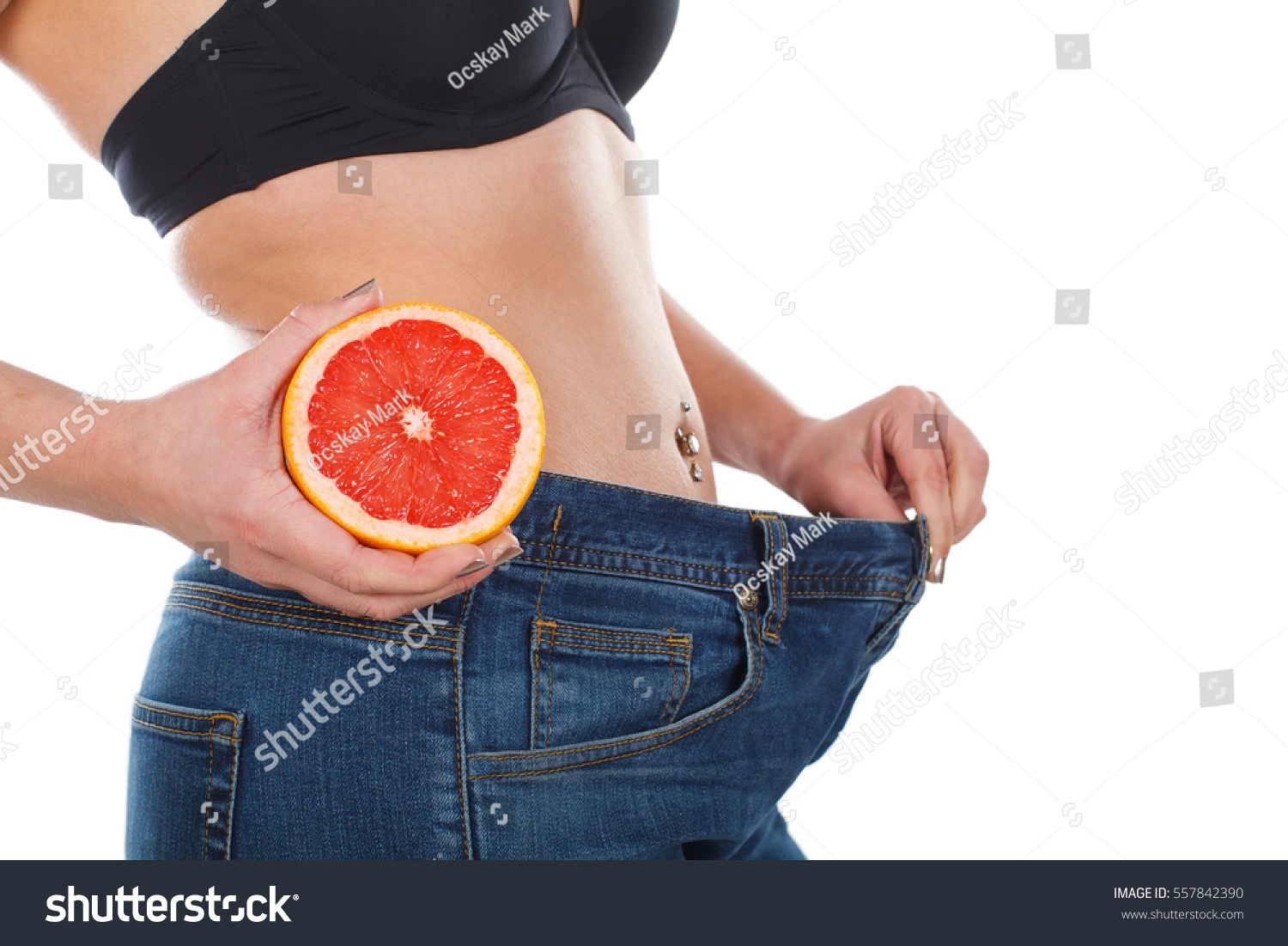 Close up picture of woman's weightloss with grapefruit diet #557842390