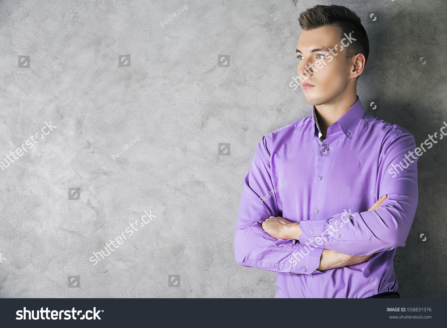 Close up portrait of attractive european male in bright purple shirt #558831976