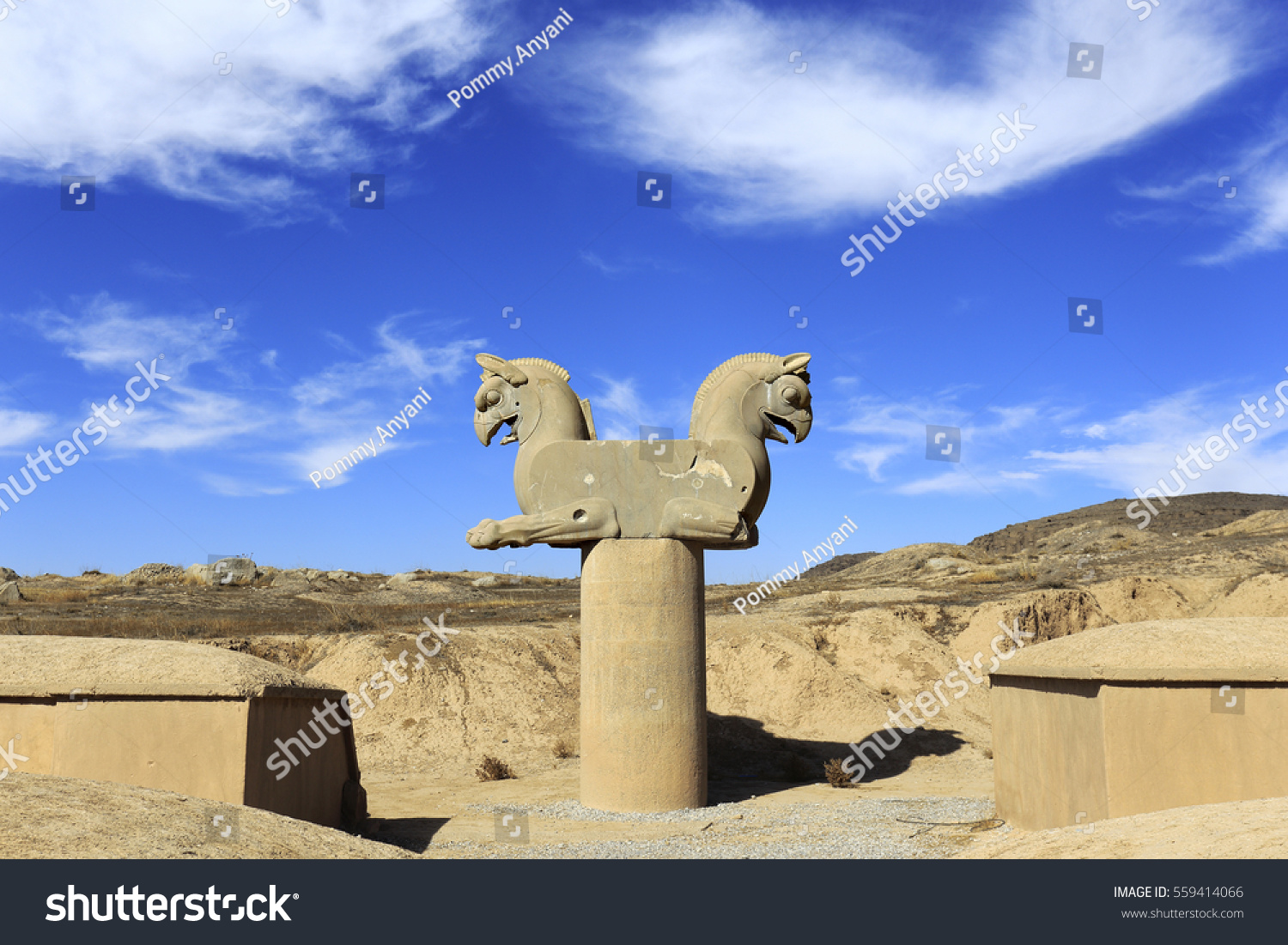 Sculpture of Achaemenid Griffin or Homa against blue sky , in Persepolis,  an ancient Persian city, Shiraz, Iran #559414066