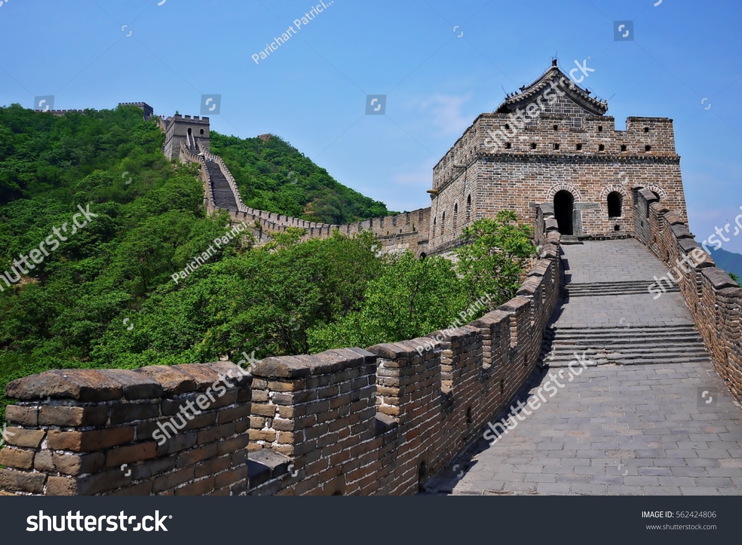 A beautiful green mountain and the watchtower of The Great Wall of China in summer at Mutianyu section nears Beijing, China. #562424806