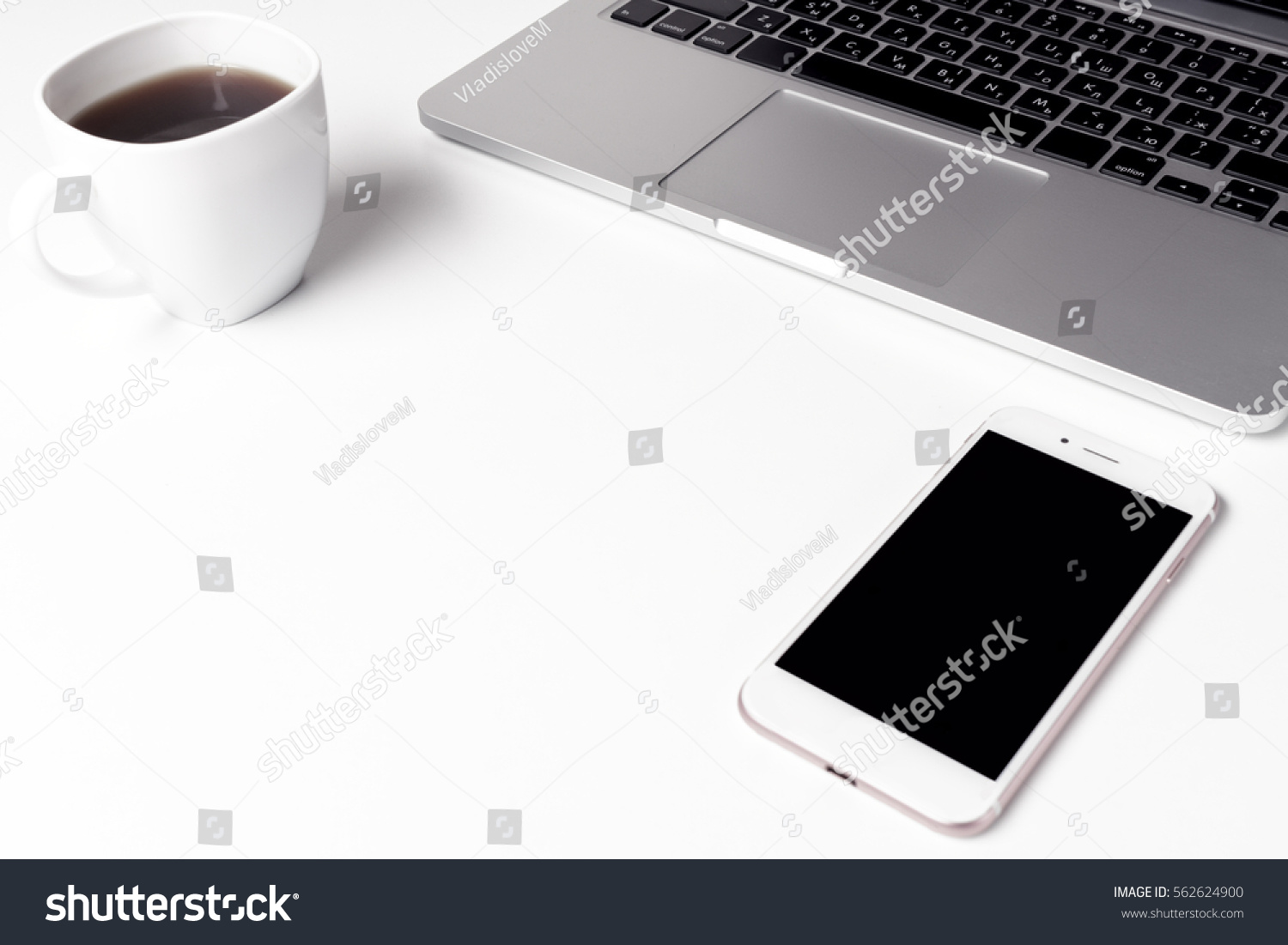 Cup With Coffee And Notebook With Pen Near Laptop At Working Space #562624900