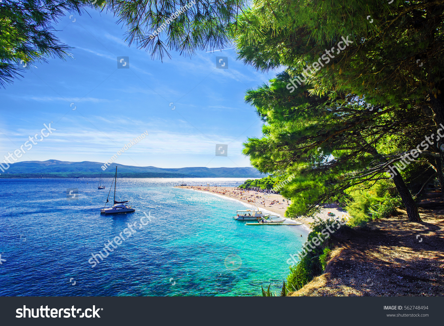 Beautiful beach Zlatni Rat or Golden Cape on island Brac in Croatia with yacht #562748494