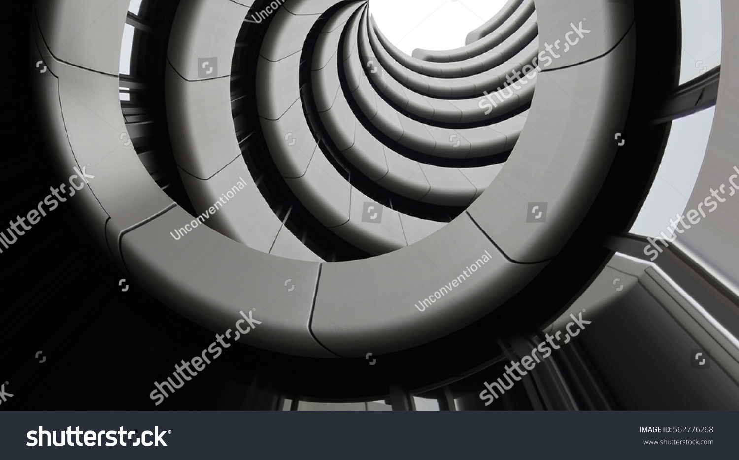Modern architecture. Underside view of curvilinear balconies. Public or office building exterior fragment. Modular architectural structures. Industry or technology motif. #562776268