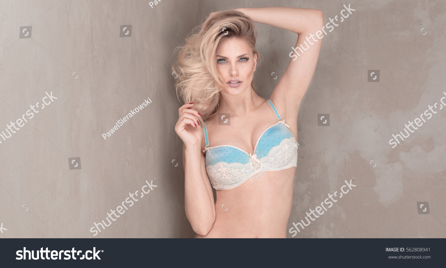 Sensual blonde woman posing in lingerie. #562808941