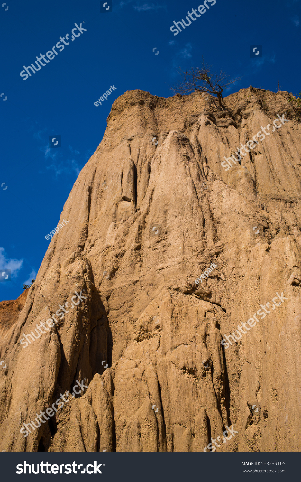 Mountain of pillar soil with blue sky, Thailand #563299105