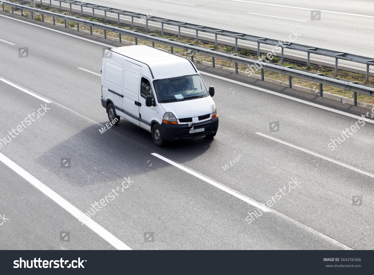 White Delivery Van On Highway #564256366