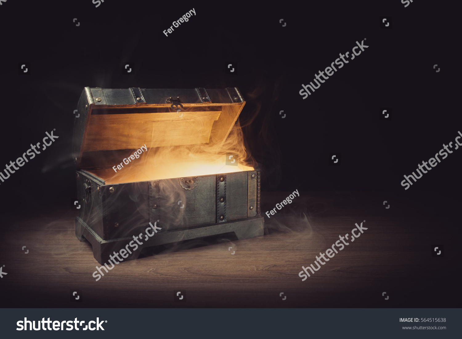 pandoras box with smoke on a wooden background #564515638