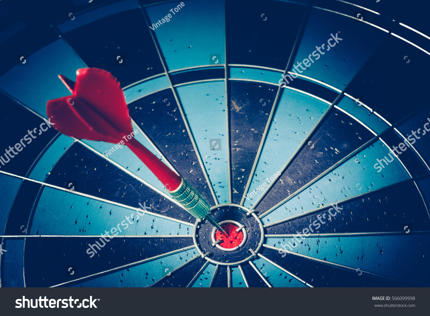 Bullseye is a target of business. Dart is an opportunity and Dartboard is the target and goal. So both of that represent a challenge in business marketing as concept. #566099998