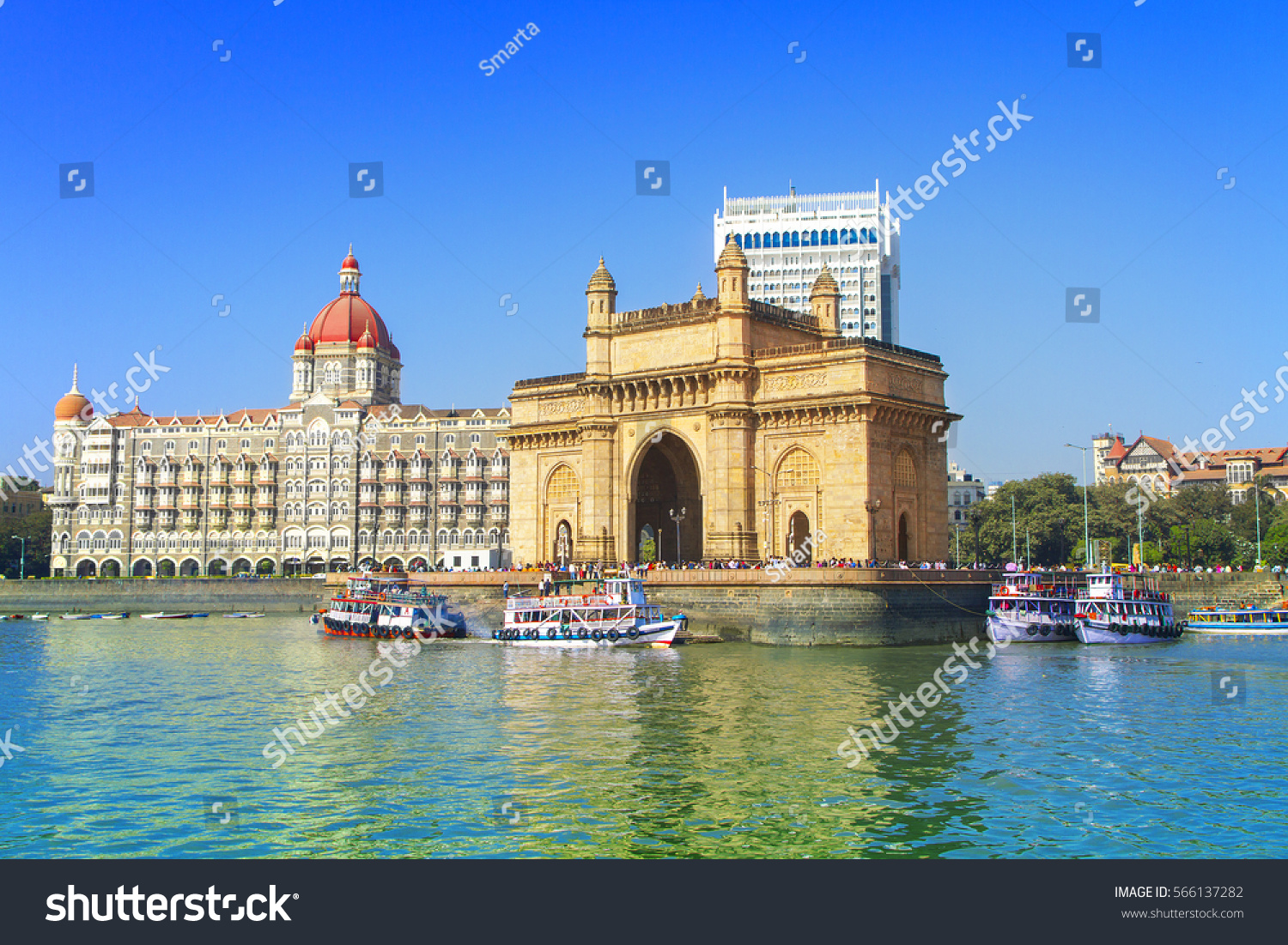 The Gateway of India and boats as seen from the Mumbai Harbour in Mumbai, India #566137282