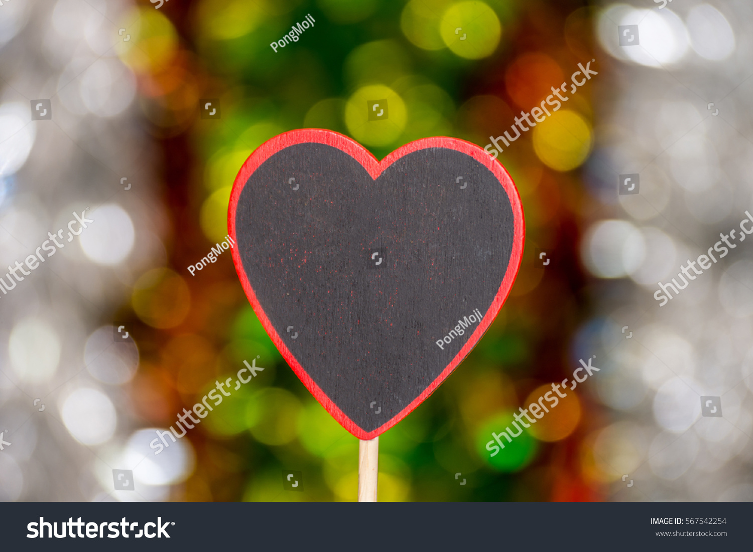 Love abstract background of light with blackboard wooden in heart shape for celebration valentine's day and wedding anniversary #567542254